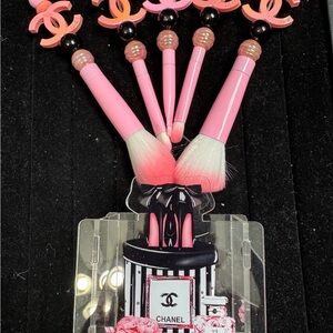Pink and black makeup brush with holder